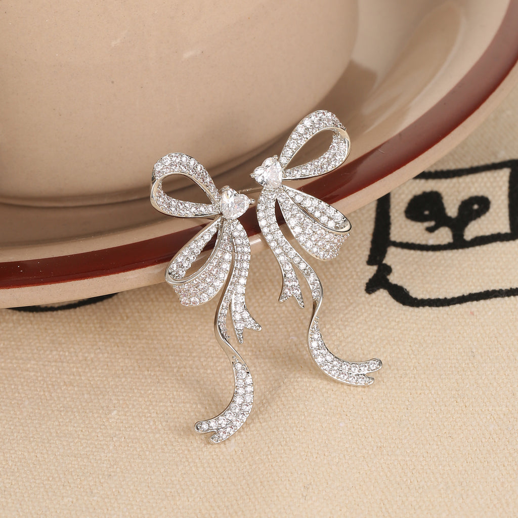 Full Pavé CZ Flowing Bow Drop Earrings | Silver Plated Brass | Wholesale OEM